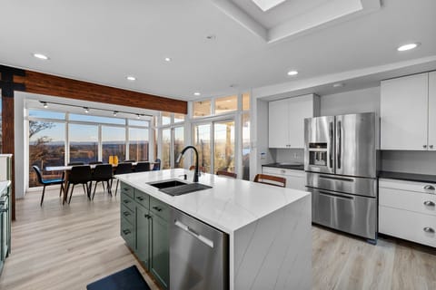 Fully stocked kitchen - stunning stainless steel appliances, kitchen island, and amazing views