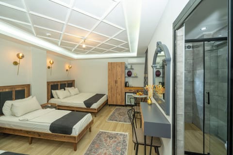 Deluxe Quadruple Room | Premium bedding, in-room safe, blackout drapes, soundproofing