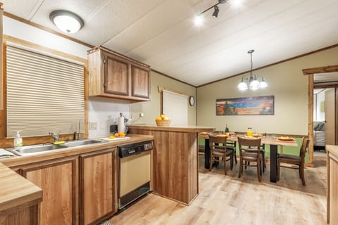 This bright, open layout makes it easy to cook, dine, and connect—with a full kitchen, spacious dining table, and plenty of natural light to set the tone.