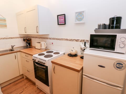 Fridge, electric kettle, toaster, cookware/dishes/utensils