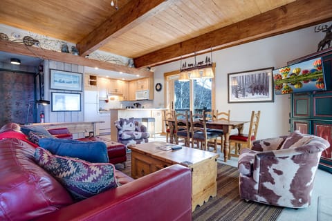 Relax in your cozy mountain retreat with exposed beams, a full kitchen, and rustic charm that makes you feel right at home.