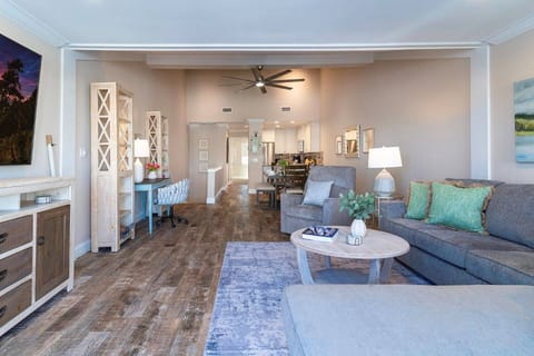 Living Area overlooking Dining Room & Kitchen which leads to Upper Level Guest Bedroom & Bathroom