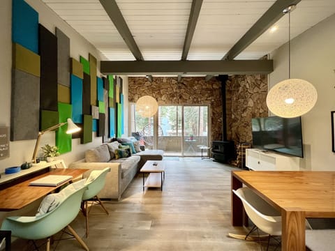 Open living area with natural light and dedicated workspace.