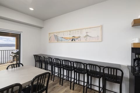 Main Level: Dining Room seating 12 at dining table and 9 on barstools