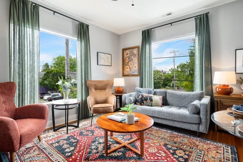 Settle into our bright and inviting living room — oversized windows, comfy seating from Article.