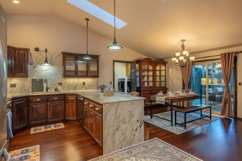 Dining, kitchen and washer/dryer area