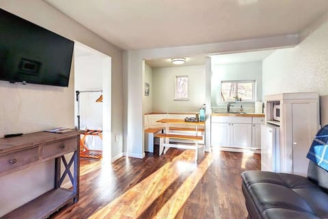  Living area with kitchenette, dining nook, TV, and lounge seating all in one clear first look.
