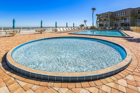 Shallow round pool ideal for kids and relaxation.
