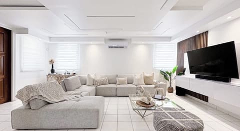 Spacious living room accommodates the entire family for quality time, movie nights playing board games.