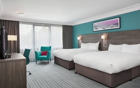 Premium bedding, desk, laptop workspace, soundproofing