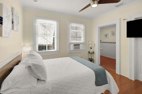 Bedroom 5 Queen Bed - 43" TV, AC, closet, vanity area.