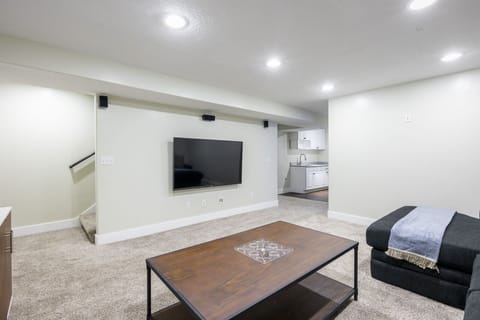 Basement living room with 65 inch TV and high speed WIFI