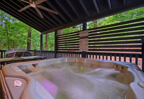 There’s something especially relaxing about slipping into the hot tub on this covered deck, where you can enjoy the outdoors no matter the weather.