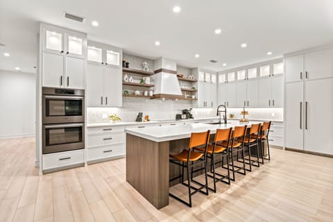 The kitchen, a chef's delight with kitchen island and breakfast bar.