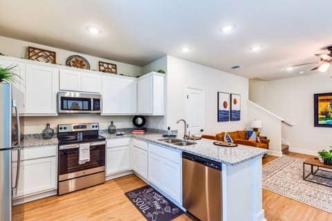 Cook up your favorite meals in a bright, well-equipped kitchen featuring modern appliances, plenty of counter space, and a built-in heater—comfortable and cozy all year round