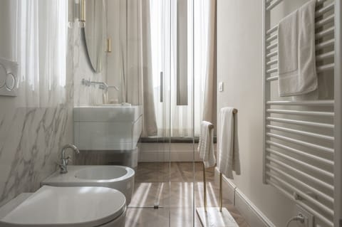 Deluxe Suite | Bathroom | Designer toiletries, hair dryer, bathrobes, slippers