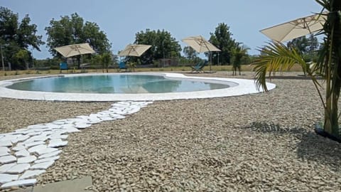 Outdoor pool, open 9:30 AM to 6:30 PM, pool umbrellas, sun loungers