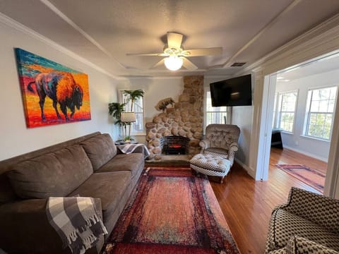 Living room with cobblestone fireplace