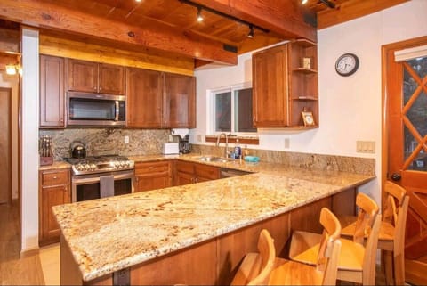 Kitchen with barstool seating area