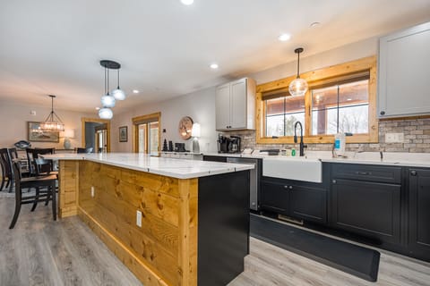 Sliding doors open to the deck for convenience when cooking out.