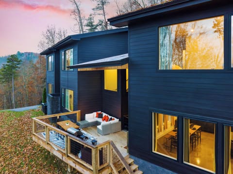 Modern mountain living meets cozy outdoor lounging with a private deck made for sunset dinners and evenings under the trees.