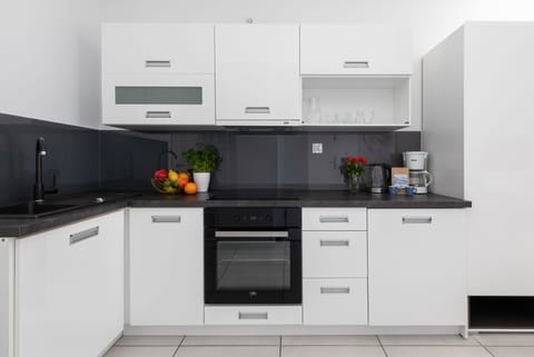 Comfort Apartment | Private kitchen | Fridge, stovetop, dishwasher, electric kettle