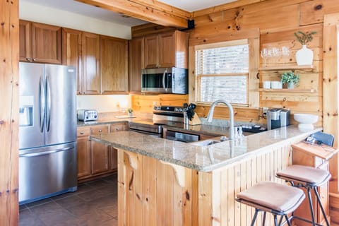 Kitchen includes stainless fridge, stove/oven, microwave, dishwasher, toaster