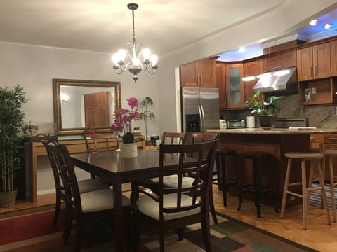 Dining table has an extender to add extra seats up to eight seaters