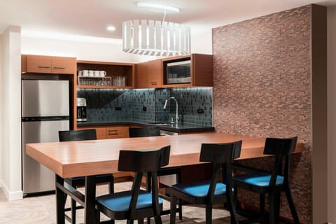 Separate Dining area and Partial Kitchen. Includes everything except a stove or oven.