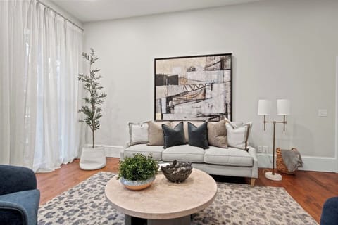 Unit #1 (1 of 3,  Ground Floor) Relax in the stylish living room with contemporary decor and plush seating, perfect for unwinding after exploring Palmyra. ️✨