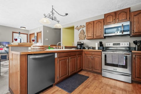 Kitchen: Whip up unforgettable meals in this fully stocked kitchen, adorned with rustic charm!