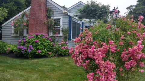 Main house with beautiful hydrangeas ,roses and flowers