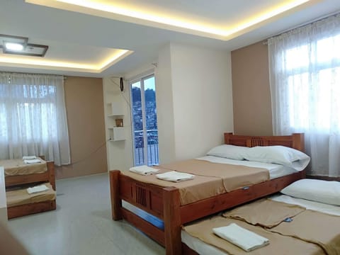 Family Room | Individually furnished, bed sheets