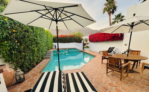 Serene View of Mountains with  2 Umbrellas, 4 Chaise Lounges. Teak Dining Table.