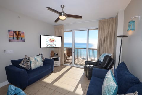 Beachfront Living Room with Gulf views, balcony access, smart TV and queen sleeper sofa