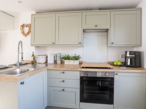 Fridge, electric kettle, toaster, cookware/dishes/utensils