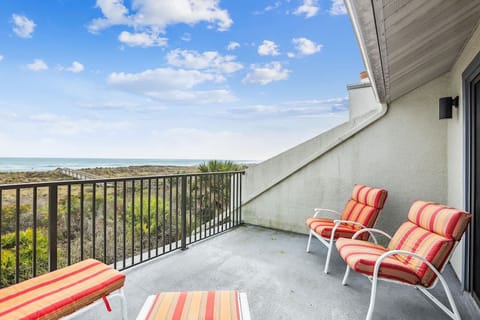 - Balcony with striped loungers for relaxing in fresh ocean air  
- Perfect spot for morning coffee or evening drinks by the sea  
- Enjoy endless horizon views and soothing sound of waves daily  

