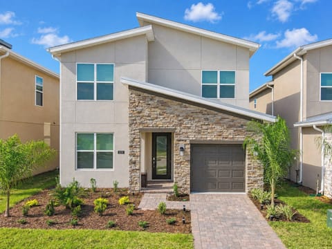 Modern Two-Story Villa Exterior with Stone Accents