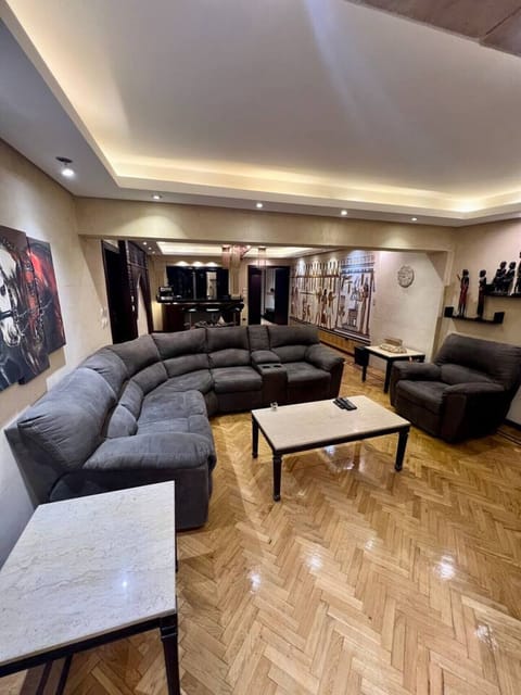 Step into comfort with our spacious, well-appointed living room, perfect for relaxation or entertaining. Featuring plush seating, elegant lighting, and chic decor, it's the ideal retreat after a day of city exploration!