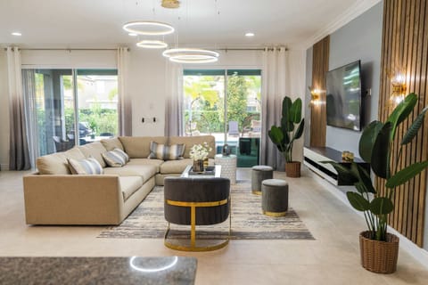 Elegant living room with modern decor and seamless indoor-outdoor flow, perfect for relaxation and entertainment.