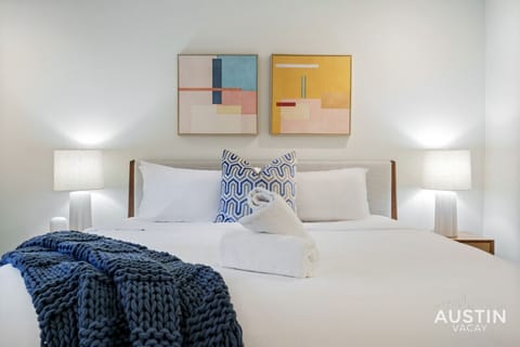 Spacious king bedroom with custom luxury hotel quality linens and patio access