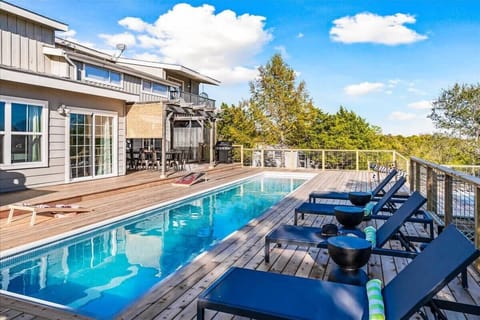 There’s so much to do in the backyard! Enjoy the use of yard games, there’s an outdoor bathroom stall with a toilet, sink, and shower, and the back porch table (which seats 8) is the perfect place for an outdoor family meal!