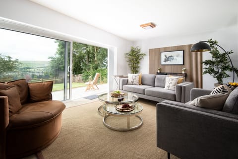 The Sheep Fold - large sliding doors open out onto the patio from the sitting room