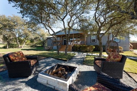 Outdoor firepit and front deck with sitting area