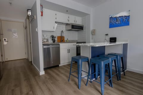 The updated kitchen has a kitchen island that sits four people.