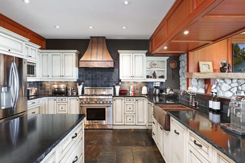 Kitchen with Thermador gas stove.