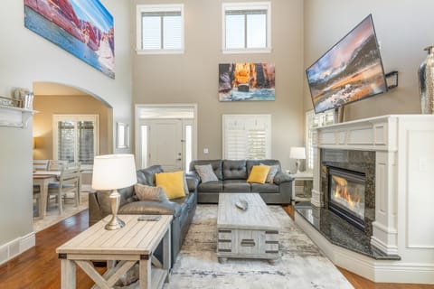 Cozy up w/ gas fireplace while watching a movie on the 65 inch tv with Disney+.