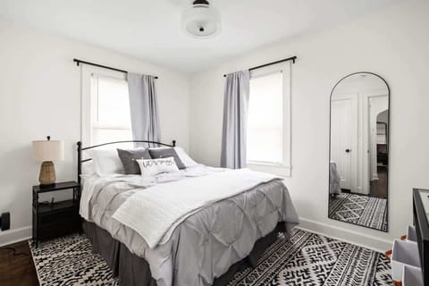 Bedroom: Experience tranquility in this stylish retreat with vibrant decor and natural light!
