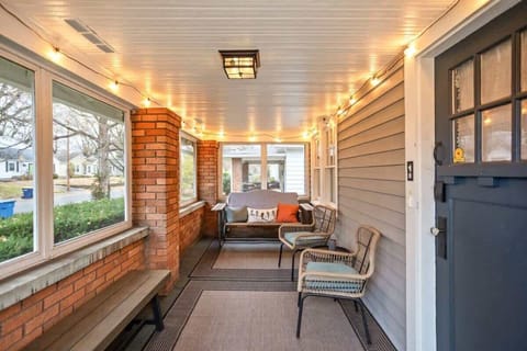 Screened Porch: Unwind with friends in this charming space, adorned with twinkling lights and comfy seating.