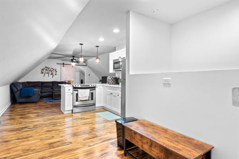 Your cozy loft features gleaming hardwood floors, a fully equipped kitchen, and comfortable living space perfect for relaxing after exploring the city.